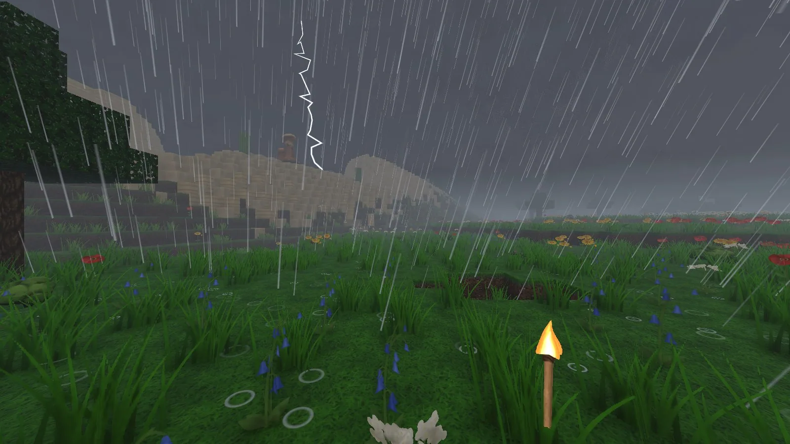 Heavy rain sweeping across a meadow under a dark sky, with a lightning bolt over the hills.