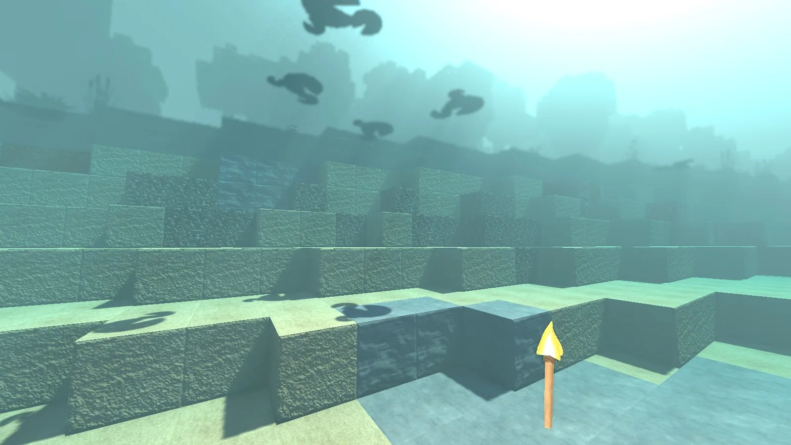 Underwater view looking up at the surface, with lily pads silhouetted against the light.